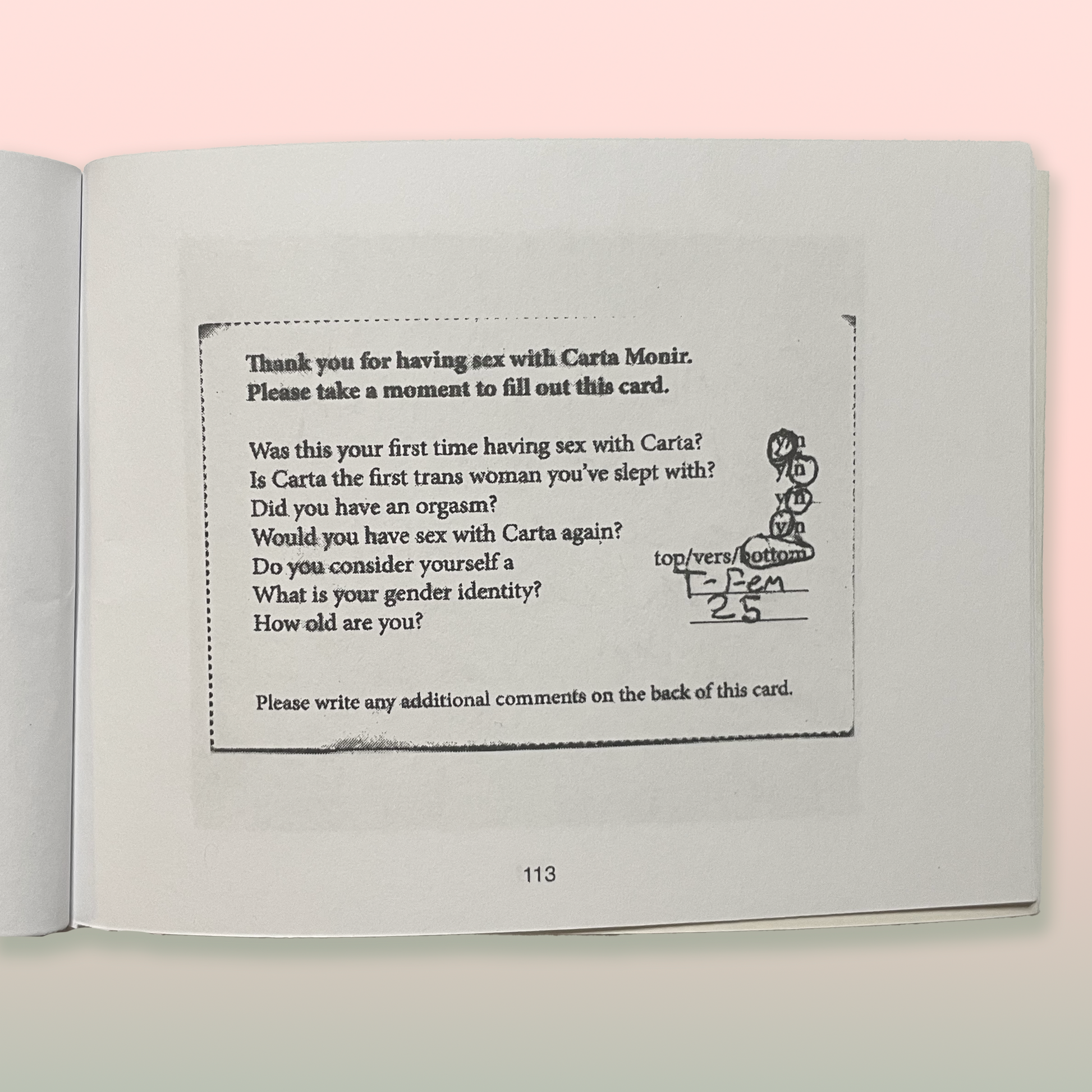 Open book with a questionnaire on a pink background